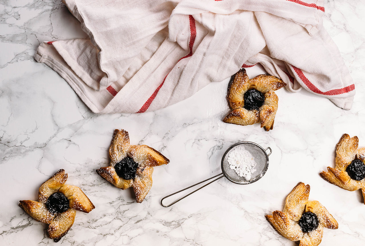 Scandinavian pastry Joulutorttu is traditional finnish and Swedish christmas pastry. It is traditionally made from puff pastry in the shape of a star or pinwheel and filled with prune jam and often dusted with icing sugar.