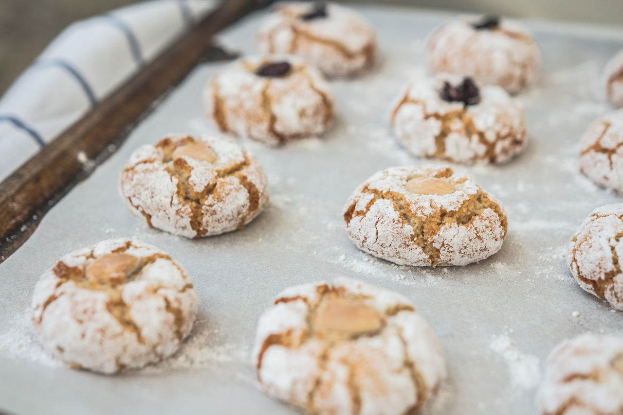 In the photo are traditional homemade Italian almond biscuit Amaretti. They are well known around the world for the delicious taste. They are gluten free. Photography is taken with natural light.