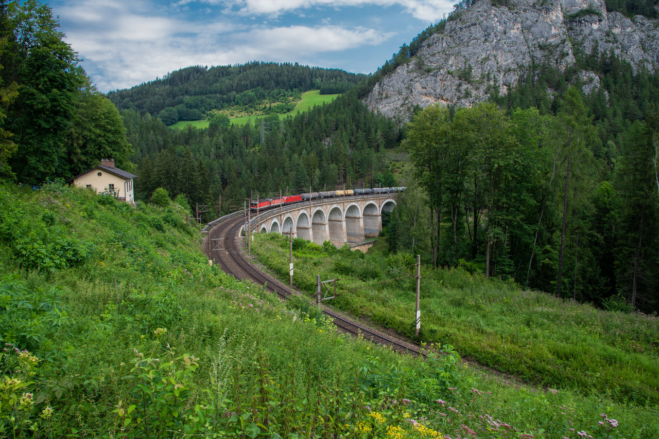 "Kalte Rinne" Viaduct with train on the Semmering Railway. The Semmering Railway is the oldest mountain railway of Europe and a Unesco World Heritage site.